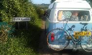 A Other Campervan called Billy Brown-1219 and Billy next to a hedge for hire in Guildford, Surrey