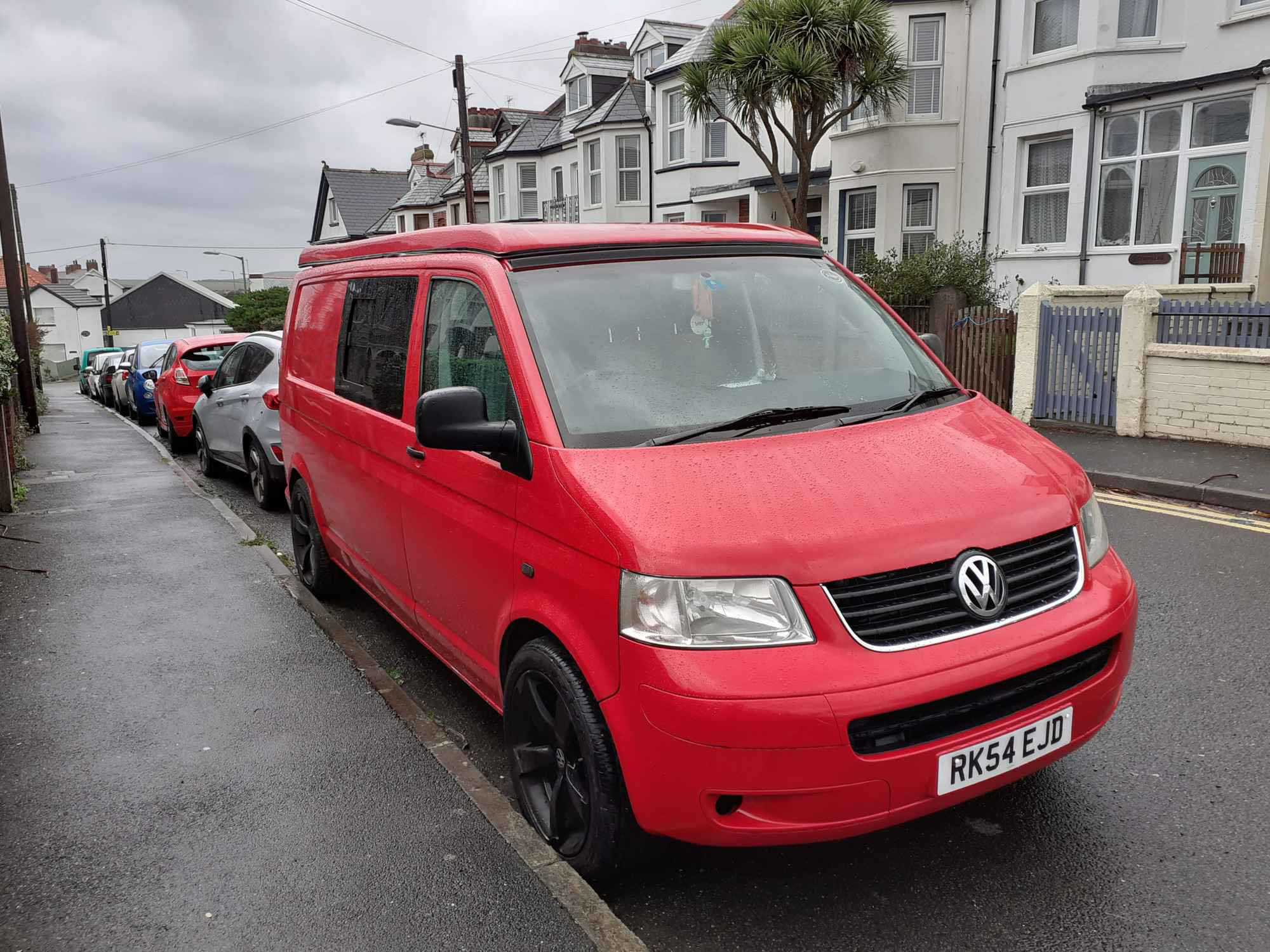 A VW T5 Campervan called Bodhi and Handsome Van, parked in a gale in Bude for hire in Windsor, Berkshire