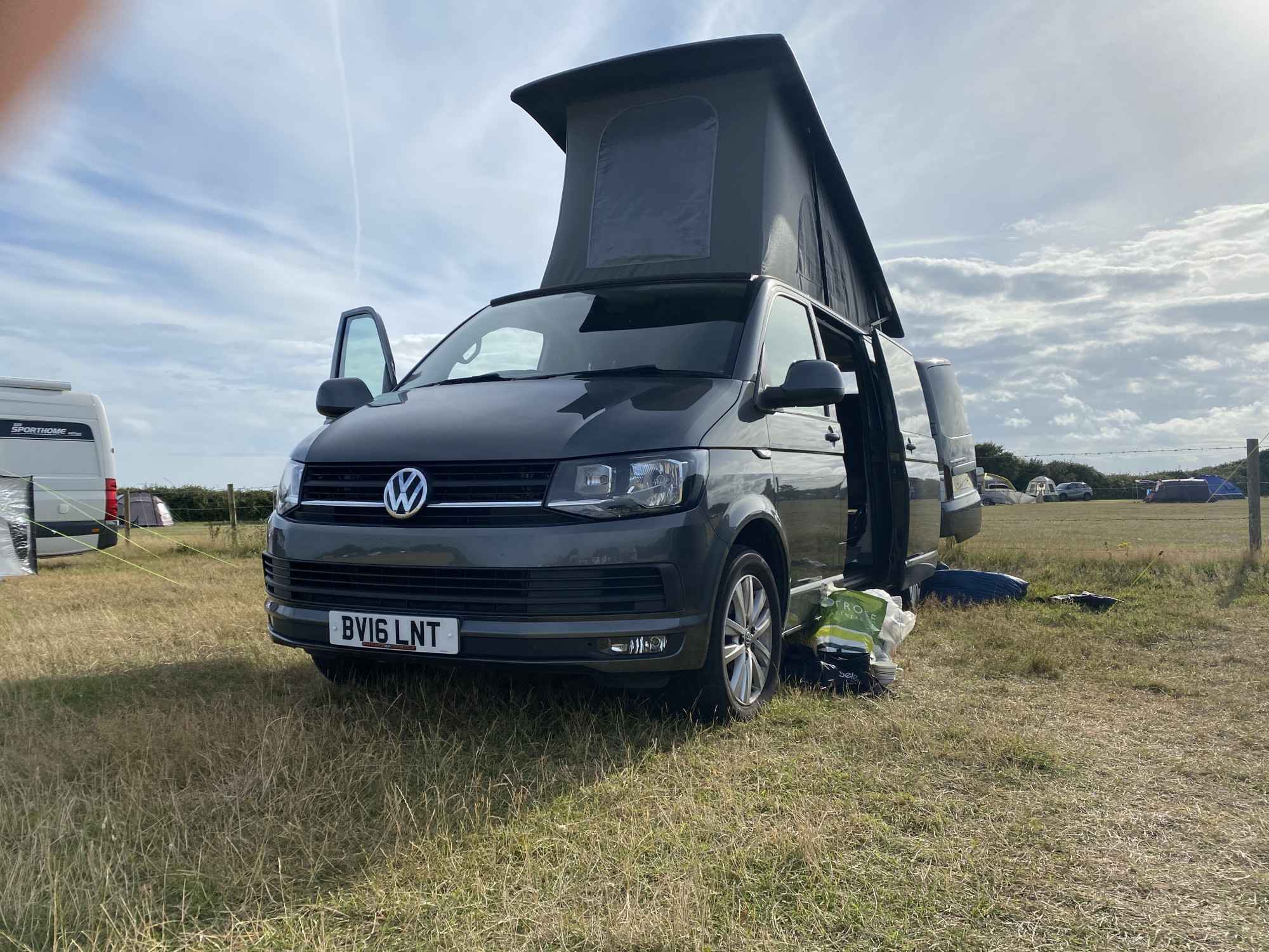 A VW T6 Campervan called CopperLeaf and With hood up, creates lots of space for hire in Milton Keynes, Buckinghamshire