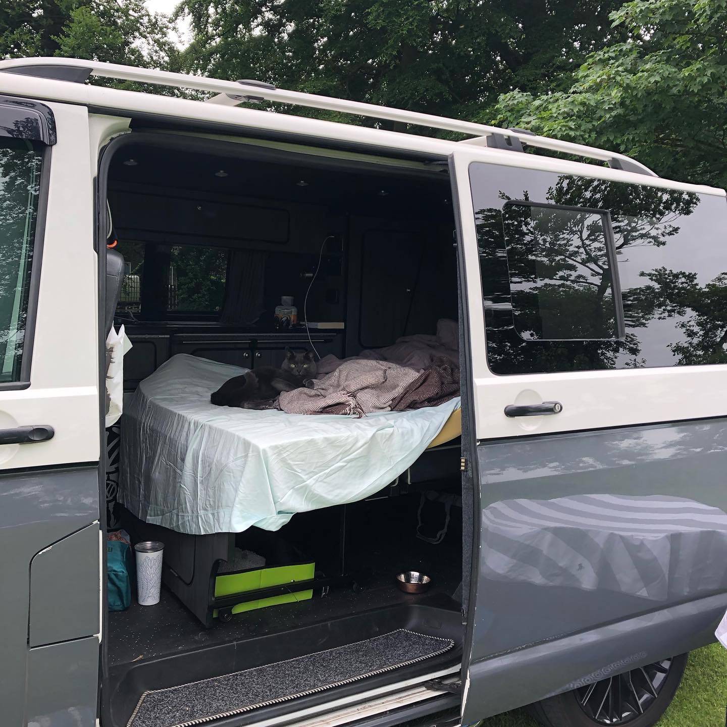 A VW T5 Campervan called Vinny and Poppy on the rock and roll bed for hire in Lancashire, Greater Manchester