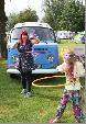 A VW T2 Classic Campervan called BlueBell-0220 and Jaime and Autumn hulahoopingin front of Bluebell. for hire in Cronton, Cheshire