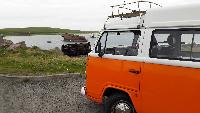 A VW T2 Classic Campervan called thunder-betty and Stopping at the Churchill barriers for hire in Orkney, Orkney Islands