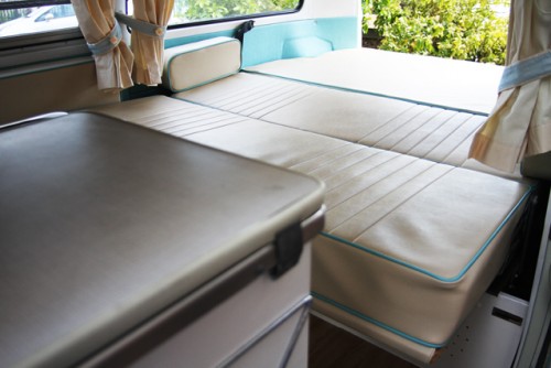 A VW T2 Classic Campervan called Harvey and The bench seat pulls out to make the full-width double bed for hire in Witham, Essex