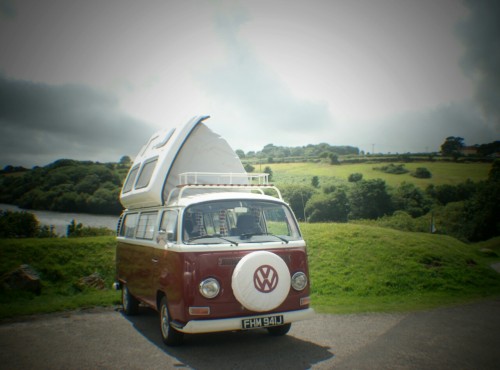 A VW T2 Classic Campervan called Ruby-Bay and Ruby with her roof up for hire in Penryn, Cornwall