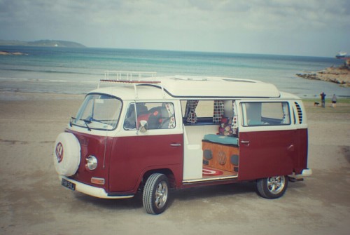 A VW T2 Classic Campervan called Ruby-Bay and Ruby at the beach for hire in Penryn, Cornwall