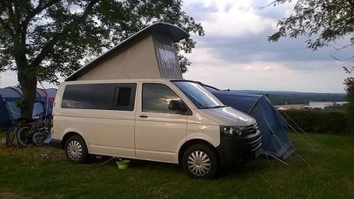 A VW T5 Campervan called Charlie and With Pop Top for hire in Dollar, 