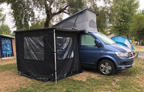 A VW T6 California Campervan called VeraT6-0720 and Side profile with awning for longer stays. Bags of space for hire in Hertford, Hertfordshire