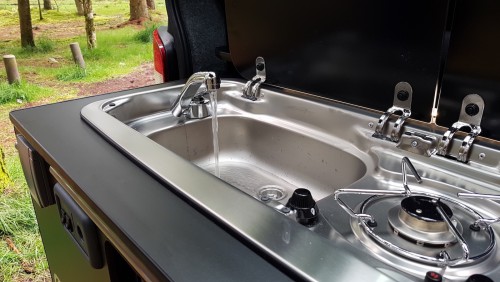 A VW T5 Campervan called Nifty1 and Sink with water tank and pump for hire in Inverness, Scotland