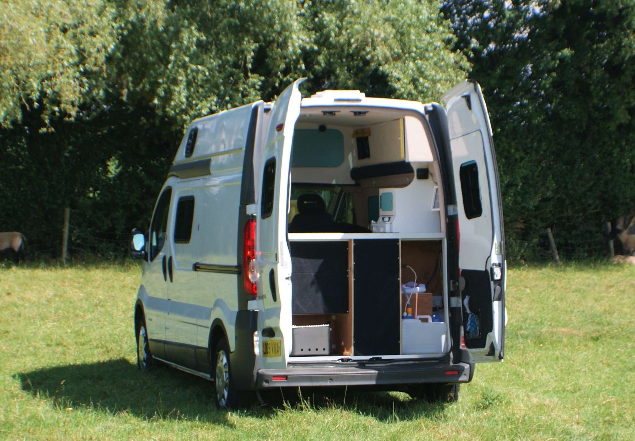 A Nissan Campervan called Molly and Additional storage and garage for water tank and gas cylinder. Easy water refilling for convenience without the need to resite the van and no fiddly refilling attachments. for hire in Ledbury, Gloucestershire