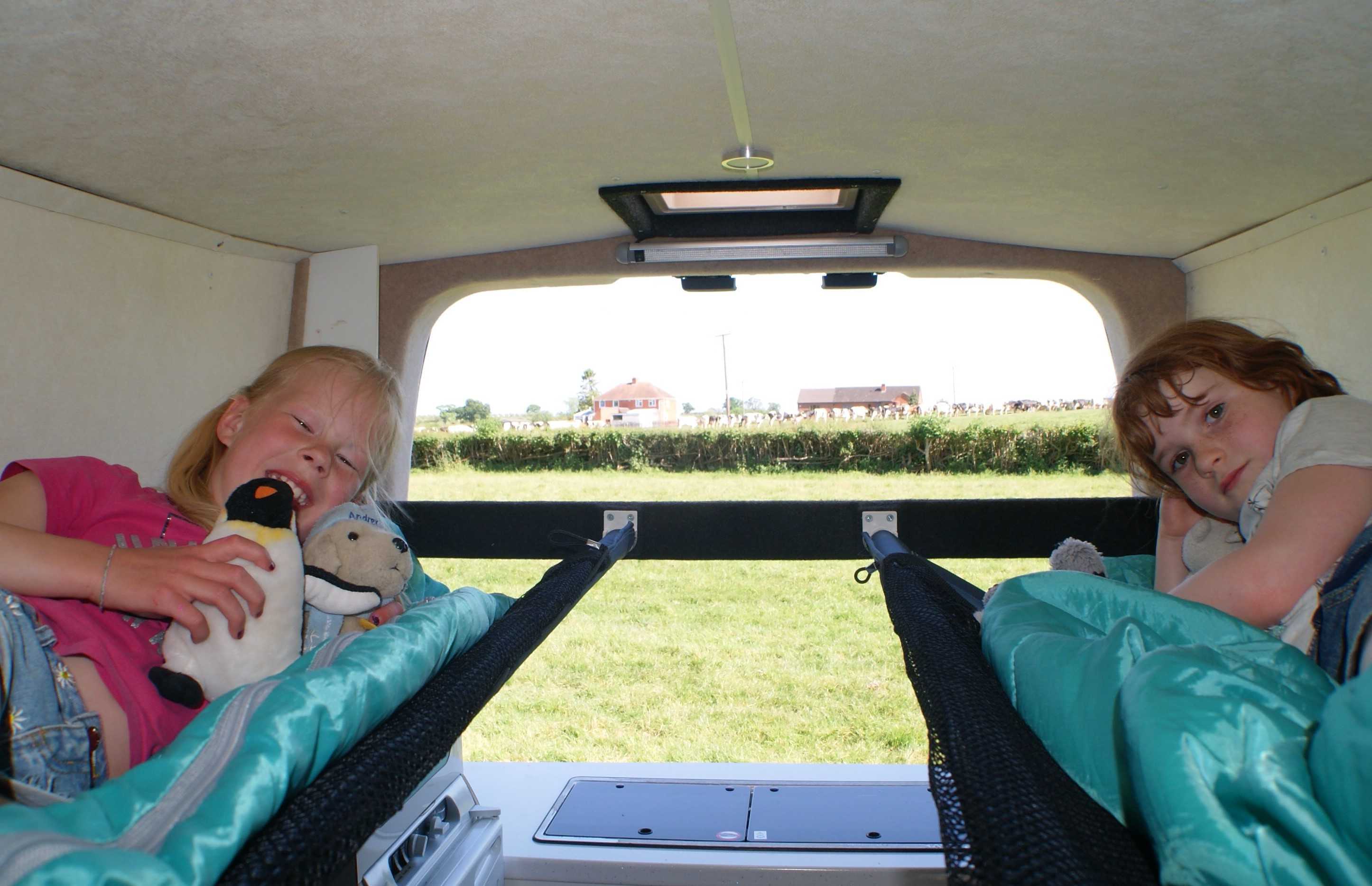 A Nissan Campervan called Molly and Roll out roof hammocks in just a couple of minutes with optional saftey nets and safety ladder. Each with own opening safety window and black out blind, perfect for star gazing. for hire in Ledbury, Gloucestershire