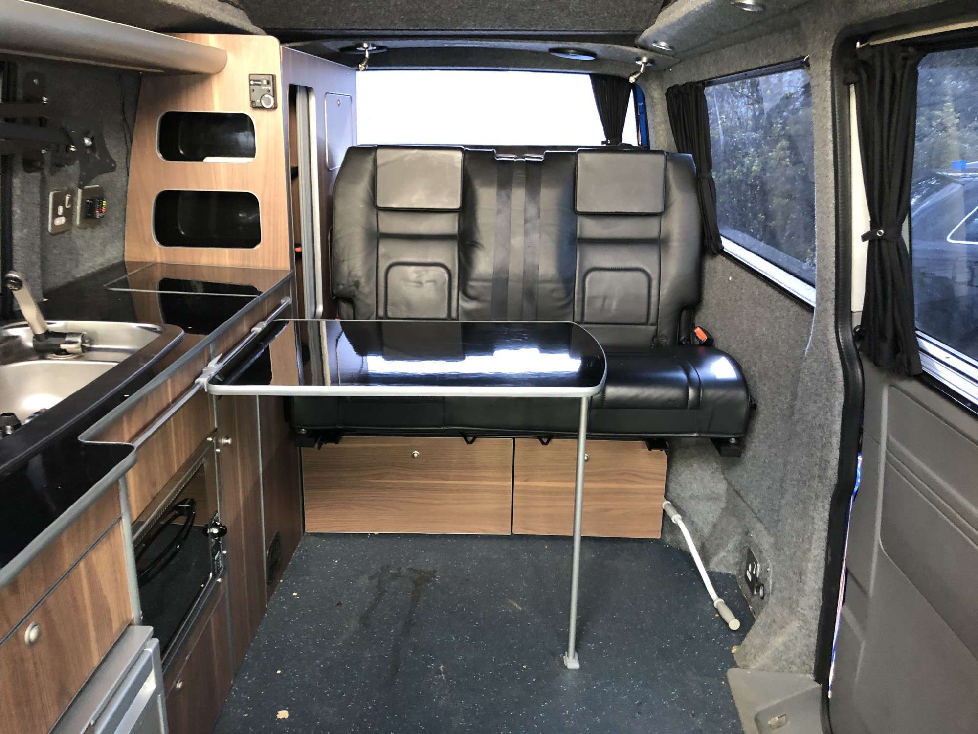 A VW T5 Campervan called Herve and Gas hob, oven and grill electric fridge, sink with electric pump tap. for hire in Gifford, East Lothian