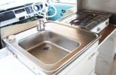 The kitchen - pump the tap for cold water and get the kettle on the gas hob... 