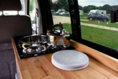 A VW T5 Campervan called Bodhi and The van's interior view for hire in Windsor, Berkshire