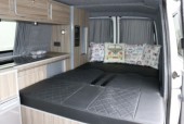 A VW T5 Campervan called Bertha and Bertha's bed down for hire in North Tawton, Devon