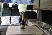 A VW T5 Campervan called Bertram and Bertram seats reversed for hire in North Tawton, Devon