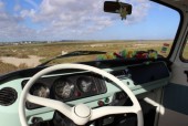A VW T2 Classic Campervan called mintymatilda and white steering wheel for hire in Faro, 