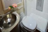 A Low Profile Motorhome called Hertz and Wash and Toilet for hire 