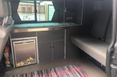 A VW T5 Campervan called rosie and Interior, including fridge freezer, sink and hob unit, storage and Rock N Roll Bed (Smart Evolution 2) for hire in South Croydon, Surrey