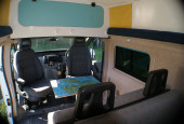 A Nissan Campervan called Molly and UK jigsaw map table for an extra smile! Plus deep over cab storage (and under bed storage too) for hire in Ledbury, Gloucestershire