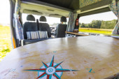 A NON VW Conversion Campervan called Lula and Fun little touches makes our camper unqiue - our coffee table is fashioned from a body board! for hire in Ledbury, Gloucestershire