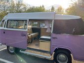 A VW T2 Brazilian Campervan called Roobarb and Sunset side door chilling in Winchester for hire in Malpas, Cheshire